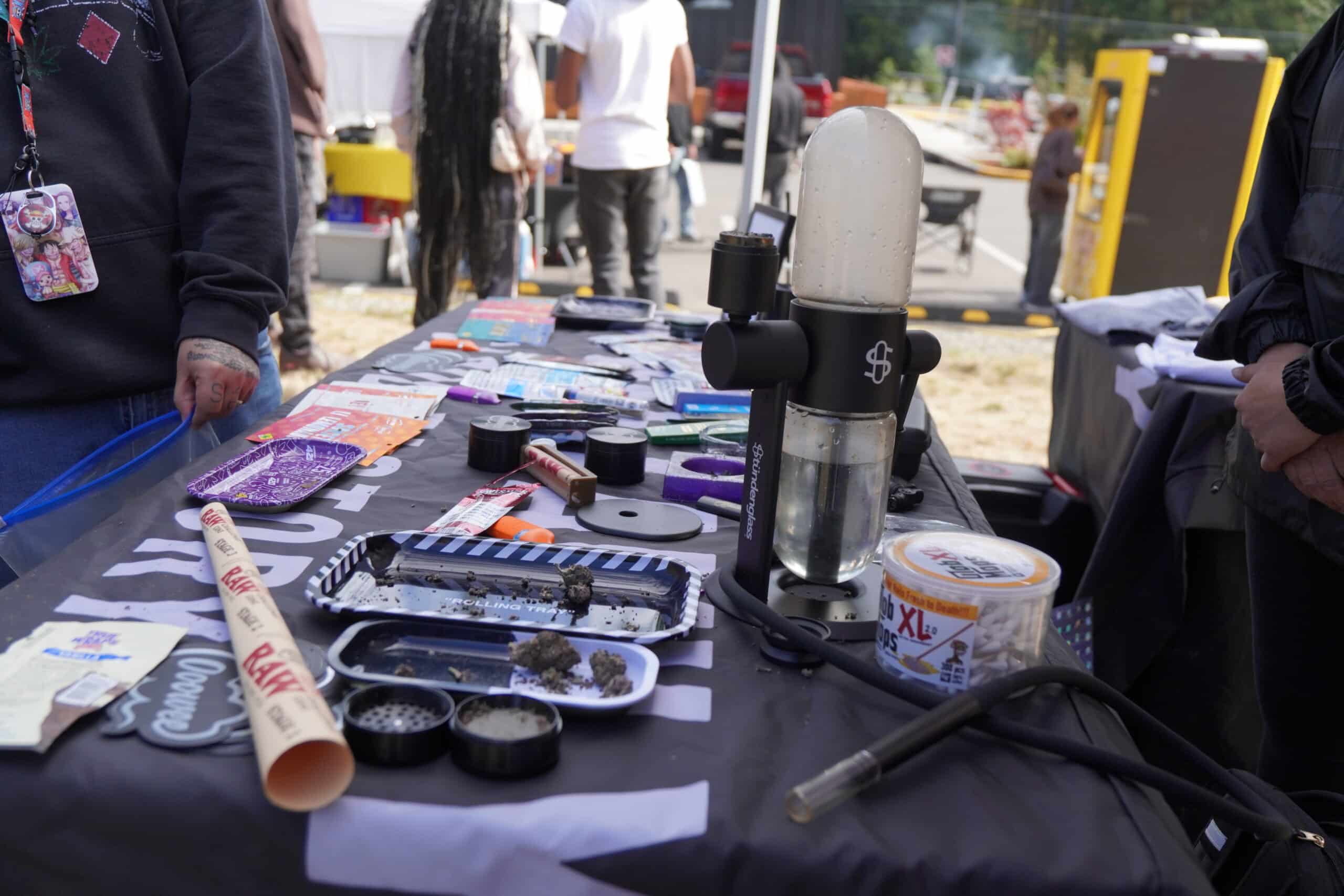 Cannabis paraphernalia litters a table.