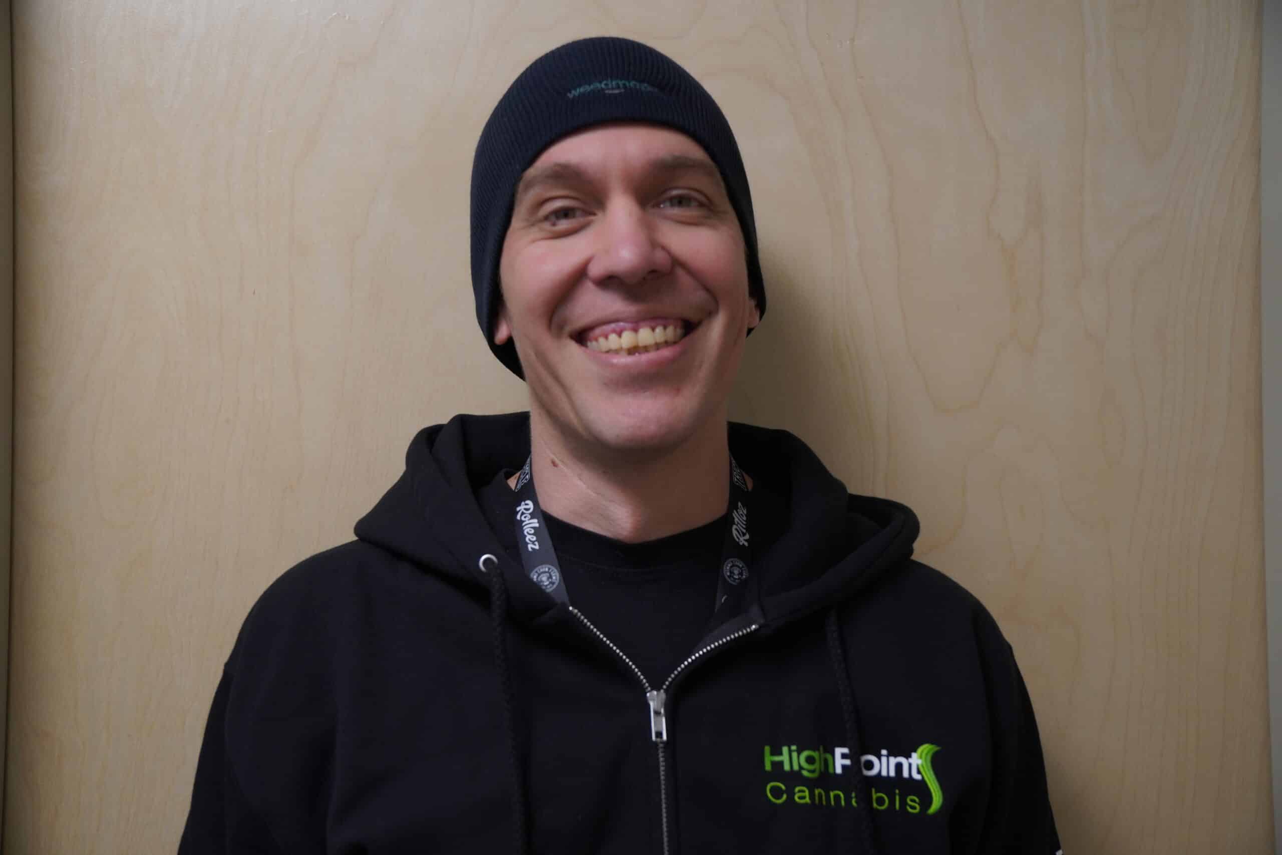 Smiling man in hoodie and beanie