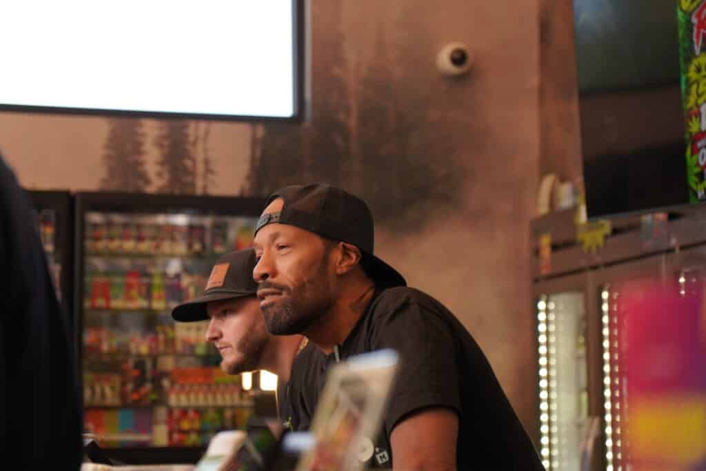 Two men at a counter.