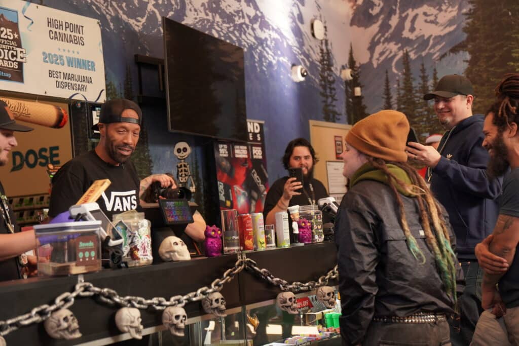 Customers interacting at a dispensary counter.