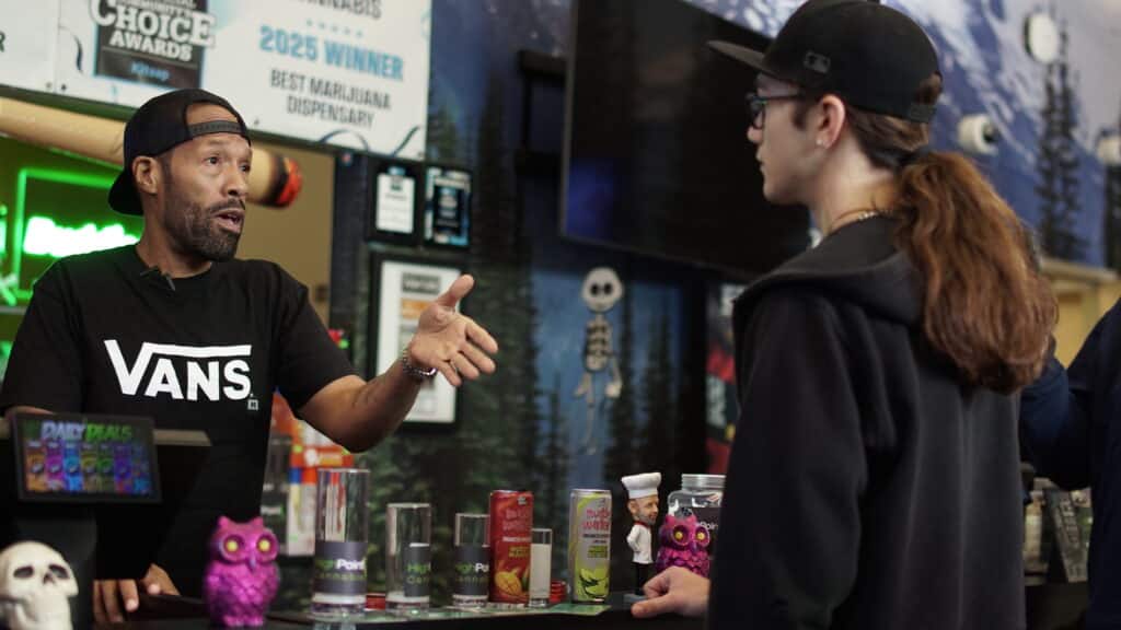Man talking to customer at counter